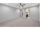 Spacious bedroom with carpet flooring leading to the primary bath at 27478 W Tonopah Dr, Buckeye, AZ 85396