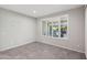 Cozy bedroom with natural light and tile flooring at 27478 W Tonopah Dr, Buckeye, AZ 85396