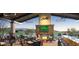 Outdoor patio with fireplace and bar at 27478 W Tonopah Dr, Buckeye, AZ 85396
