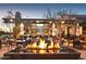 Large outdoor patio with fire pit and seating at 27478 W Tonopah Dr, Buckeye, AZ 85396