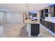 Open concept kitchen with a large granite island, seamlessly flowing into the adjacent living spaces at 27478 W Tonopah Dr, Buckeye, AZ 85396