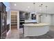Elegant kitchen featuring a large pantry, stainless steel appliances, and stylish countertops at 27478 W Tonopah Dr, Buckeye, AZ 85396