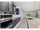 Modern kitchen features stainless steel appliances, granite countertops, and ample cabinet space at 27478 W Tonopah Dr, Buckeye, AZ 85396