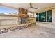 Relax in this covered outdoor space with a stone fireplace and built in bench seating at 27478 W Tonopah Dr, Buckeye, AZ 85396