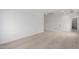 A well-lit room with neutral carpet and access to the hallway at 9042 N 116Th Ln, Youngtown, AZ 85363