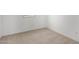 View of a carpeted room with a bright window and light colored walls at 9042 N 116Th Ln, Youngtown, AZ 85363