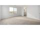 Neutral bedroom featuring carpet, and windows that offer tranquil outdoor views at 9042 N 116Th Ln, Youngtown, AZ 85363