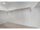 Carpeted walk-in closet with rod and shelf for efficient storage at 9042 N 116Th Ln, Youngtown, AZ 85363