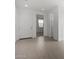 Bright entryway featuring neutral tile floors and a contemporary white door leading into the home at 9042 N 116Th Ln, Youngtown, AZ 85363