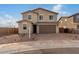Charming two-story home featuring a neutral color palette, a two-car garage, and a well-maintained front yard at 9042 N 116Th Ln, Youngtown, AZ 85363