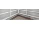Spacious walk-in pantry with ample shelving and tile flooring for organized storage at 9042 N 116Th Ln, Youngtown, AZ 85363