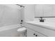 Clean bathroom featuring a tub, a toilet, and a vanity with matte black hardware at 16620 N Dante Way, Maricopa, AZ 85138