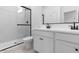 Modern bathroom featuring a glass-enclosed shower, dual sinks, and sleek fixtures at 16620 N Dante Way, Maricopa, AZ 85138