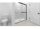 Bathroom with glass enclosed shower and modern fixtures at 16620 N Dante Way, Maricopa, AZ 85138