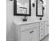 Bathroom featuring double vanity with modern matte black fixtures at 16620 N Dante Way, Maricopa, AZ 85138