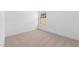 Empty bedroom with neutral carpeting and window at 16620 N Dante Way, Maricopa, AZ 85138