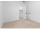 Bright bedroom featuring neutral carpet, white walls, and walk-in closet at 16620 N Dante Way, Maricopa, AZ 85138