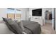 Contemporary bedroom featuring a TV, neutral decor, and walk-in closet at 16620 N Dante Way, Maricopa, AZ 85138