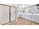 Modern bathroom showcasing a glass shower and double vanity with sleek finishes at 28266 N 134Th Dr, Peoria, AZ 85383