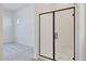 Elegant bathroom with glass shower and a view into the bedroom at 28266 N 134Th Dr, Peoria, AZ 85383