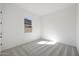Bright bedroom with plush carpeting and a window offering natural light at 28266 N 134Th Dr, Peoria, AZ 85383