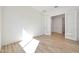Open bedroom with double french doors, light tile floors, and neutral colored walls at 28266 N 134Th Dr, Peoria, AZ 85383