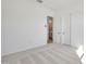 An inviting bedroom with neutral carpeting, and an open doorway at 28266 N 134Th Dr, Peoria, AZ 85383