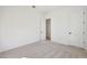 Neutral bedroom with carpet and trim, complemented by a white door at 28266 N 134Th Dr, Peoria, AZ 85383