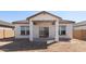 This home features a covered patio and a large, private backyard at 16610 N Dante Way, Maricopa, AZ 85138