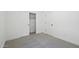 This bedroom has a carpeted floor and a closet with white sliding doors at 16610 N Dante Way, Maricopa, AZ 85138