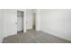 Cozy bedroom with plush carpeting, a closet, and a view to the outside at 16610 N Dante Way, Maricopa, AZ 85138