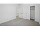 Bright bedroom with neutral carpet, closet, and a view into another room at 16610 N Dante Way, Maricopa, AZ 85138