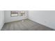 Bright bedroom with neutral carpet and a window offering natural light at 16610 N Dante Way, Maricopa, AZ 85138