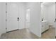 Inviting entryway with tile flooring, a half bath, and a glimpse into the home at 16610 N Dante Way, Maricopa, AZ 85138