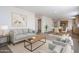 Open-concept living area with modern furnishings, flowing into the dining area and kitchen at 249 N 89Th St, Mesa, AZ 85207