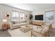 Bright living room with a neutral color palette, a large sofa, and stylish decor at 249 N 89Th St, Mesa, AZ 85207
