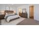 Cozy main bedroom featuring neutral tones, soft lighting, and a private ensuite bathroom at 249 N 89Th St, Mesa, AZ 85207