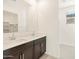 Modern bathroom with double vanity and shower at 9145 N 173Rd Ln, Waddell, AZ 85355