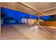 Covered backyard patio overlooking the desert landscaping offering ample space for outdoor activities and relaxation at 13108 N 76Th St, Scottsdale, AZ 85260