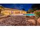 Inviting backyard with a sparkling pool, patio seating, and lush desert landscaping, perfect for relaxation at 13108 N 76Th St, Scottsdale, AZ 85260