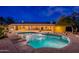 Backyard oasis featuring a sparkling pool with waterfall and a covered patio perfect for outdoor entertaining at 13108 N 76Th St, Scottsdale, AZ 85260