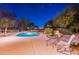 Secluded backyard featuring a pool, desert landscape and comfortable lounge area for relaxation at 13108 N 76Th St, Scottsdale, AZ 85260
