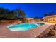 Lush backyard features a sparkling pool, desert landscaping, and comfortable seating areas for outdoor enjoyment at 13108 N 76Th St, Scottsdale, AZ 85260