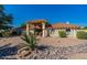 Spanish style home with tile roof and desert landscaping at 13108 N 76Th St, Scottsdale, AZ 85260