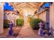 Inviting entryway with manicured landscaping and architectural details under a covered walkway at 13108 N 76Th St, Scottsdale, AZ 85260