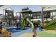 Modern playground with multiple towers, slides, and interactive play areas at 22446 E Russet Rd, Queen Creek, AZ 85142