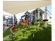 Dynamic playground area with climbing structures and covered seating at 22446 E Russet Rd, Queen Creek, AZ 85142
