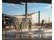 Children enjoying the splash pad feature, offering refreshing fun on a sunny day at 22446 E Russet Rd, Queen Creek, AZ 85142