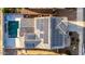 Aerial view of a home featuring solar panels and an inviting backyard pool at 4102 S 186Th Ave, Goodyear, AZ 85338