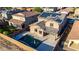 Aerial view of backyard with pool, patio, solar panels, and lush landscaping at 4102 S 186Th Ave, Goodyear, AZ 85338